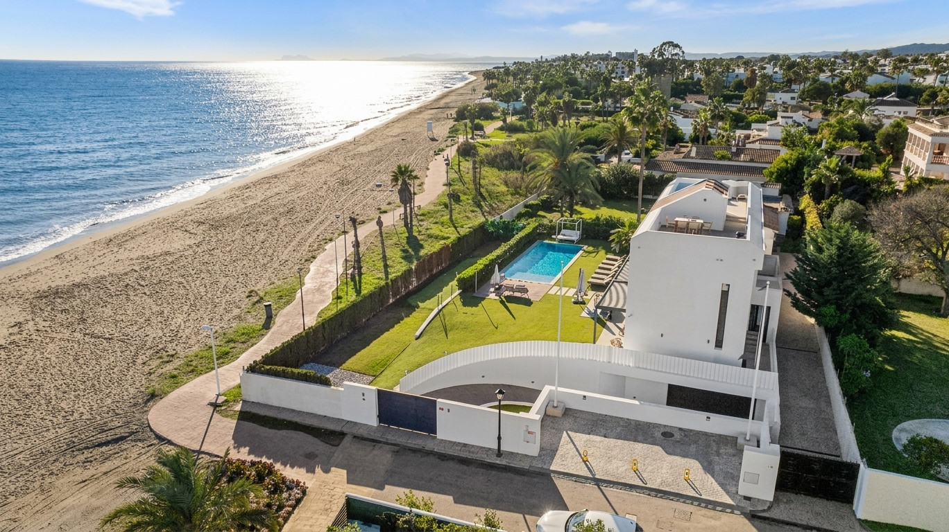 Aerial view of the villa, private pool and beachfront setting at El Saladillo — El Saladillo Beachfront Residence