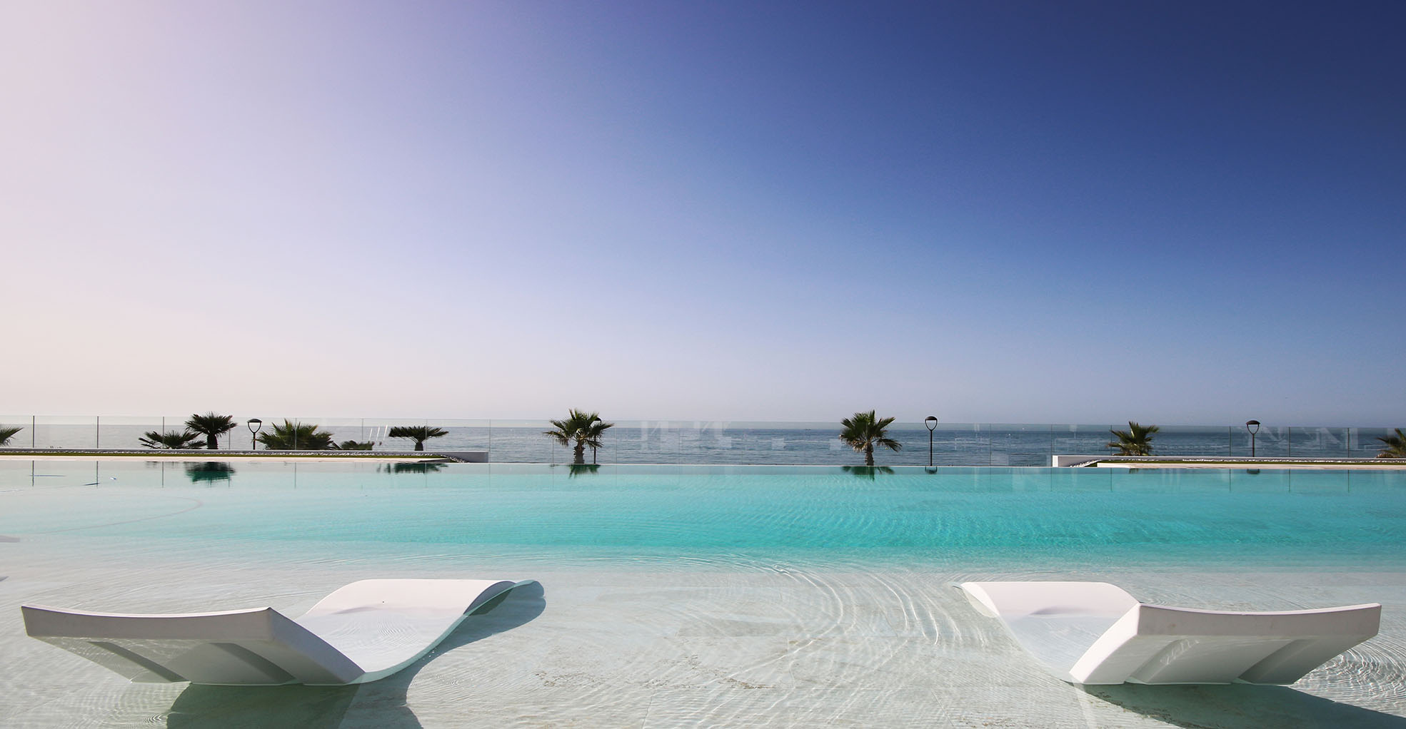 Developer visualisation of Emare’s shared pool and sun loungers overlooking the Mediterranean