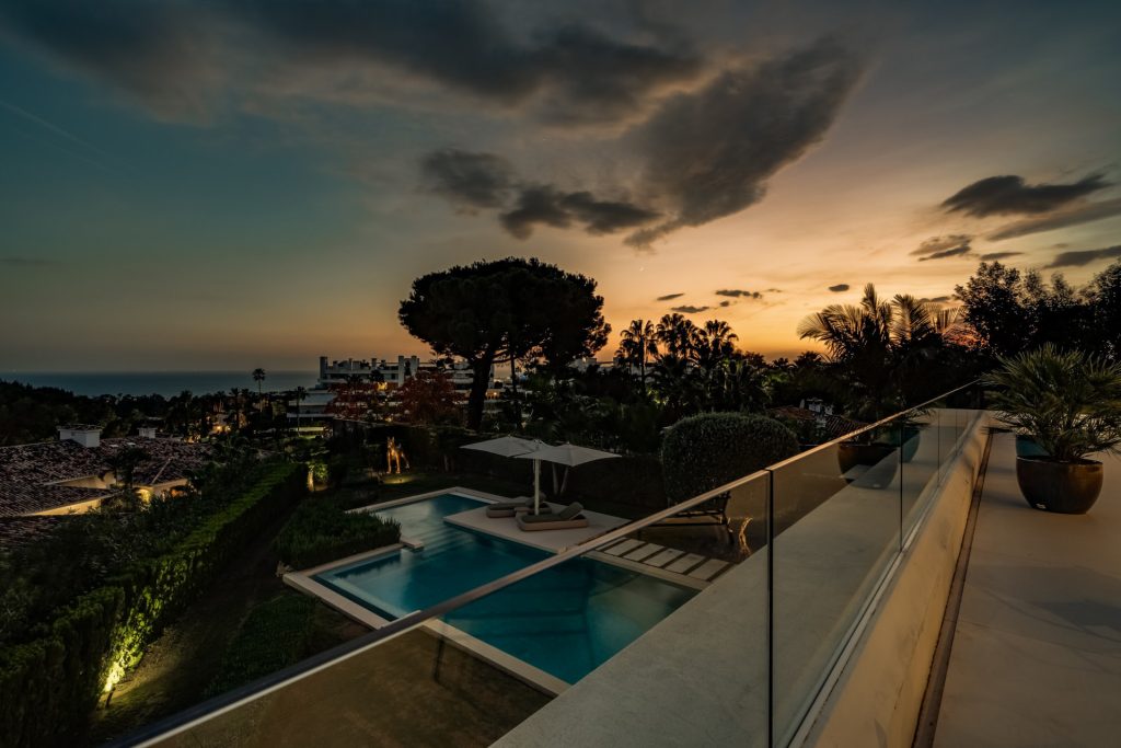 Pool and coastline at dusk — Golden Mile Residence