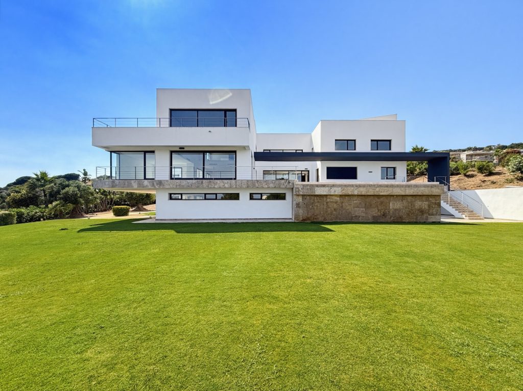 Daytime view of the villa from the lawn — La Reserva Residence