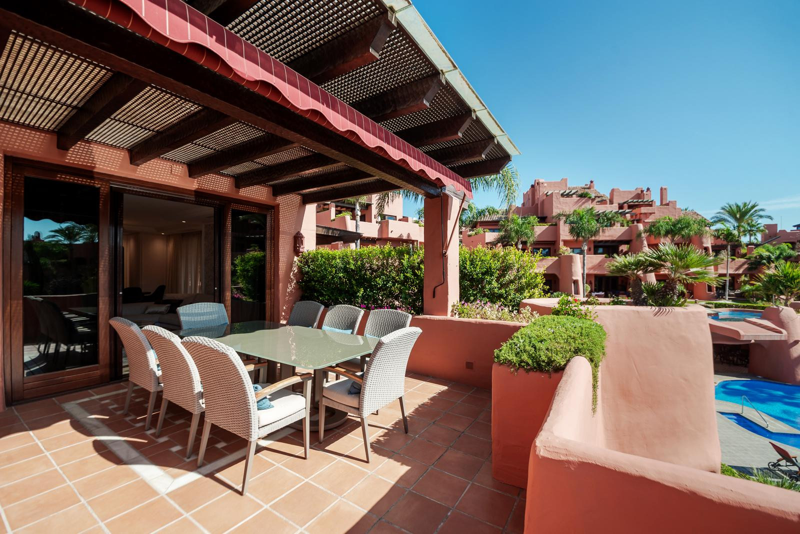Covered dining terrace overlooking Torre Bermeja's gardens and pool — Torre Bermeja Penthouse