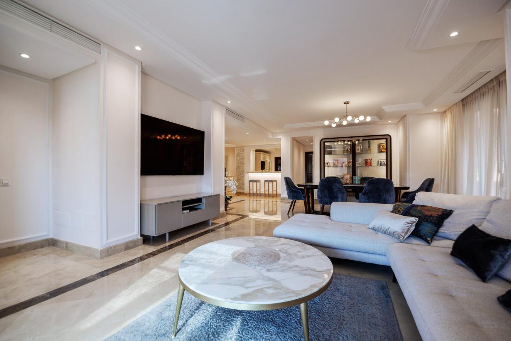 Living room with marble flooring and terrace doors — Torre Bermeja Penthouse
