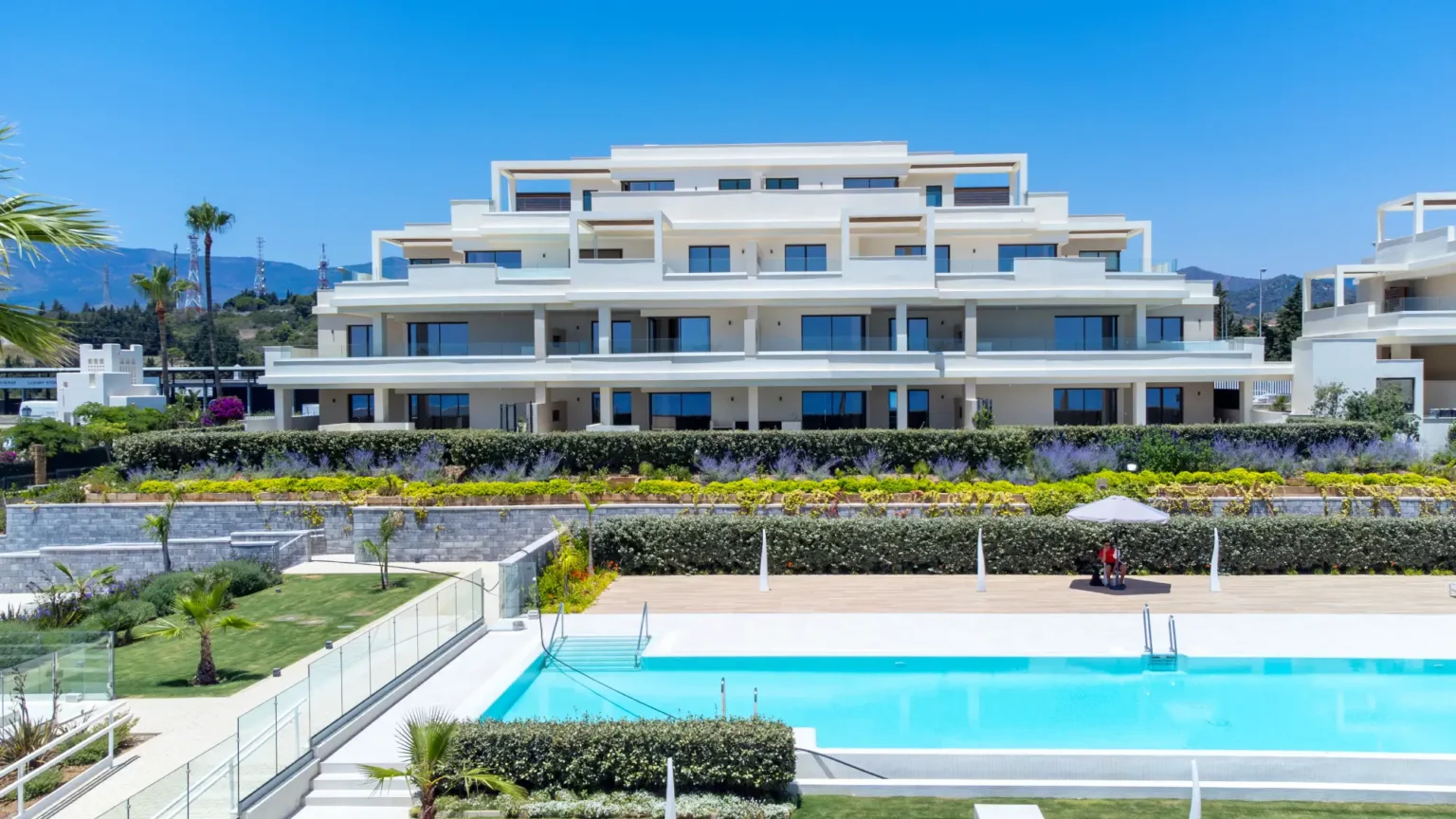 Velaya’s shared swimming pool, planted gardens and broad apartment terraces